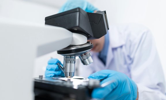 researcher and microscope